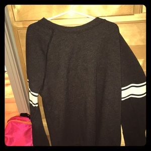 Grey sweat shirt with white stripes on sleeves